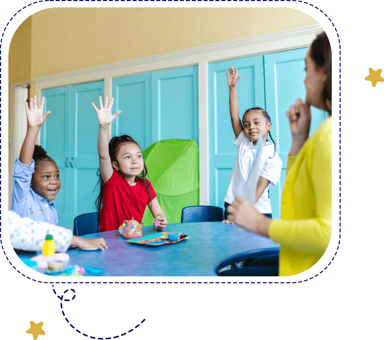 Children Raising Hands in the Class